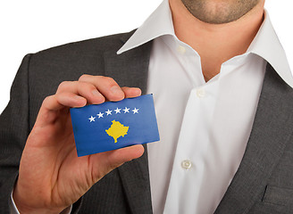 Image showing Businessman is holding a business card, Kosovo