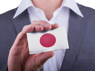 Image showing Businessman showing card, matte paper effect