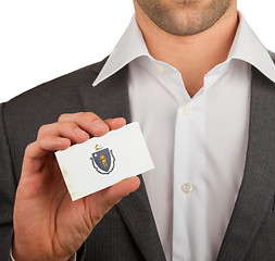 Image showing Businessman is holding a business card, Massachusetts