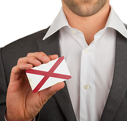 Image showing Businessman is holding a business card, Alabama