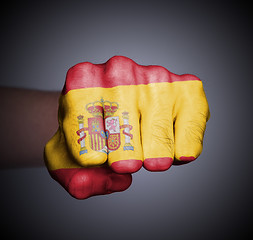 Image showing Front view of punching fist on gray background