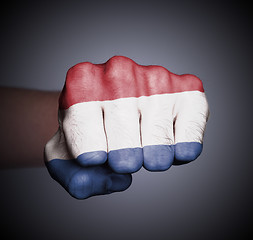 Image showing Front view of punching fist on gray background