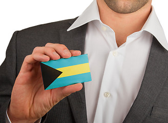 Image showing Businessman is holding a business card, The Bahamas