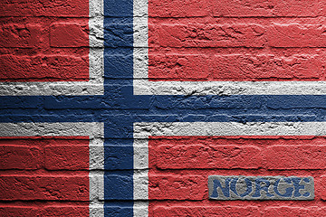 Image showing Brick wall with a painting of a flag