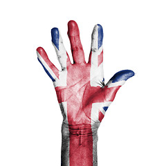 Image showing Hand of an old woman, wrapped with a pattern of the flag of the 