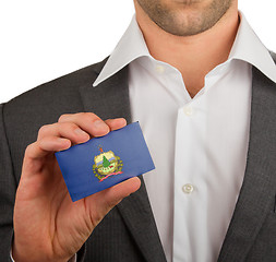 Image showing Businessman is holding a business card, Vermont