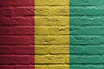 Image showing Brick wall with a painting of a flag, Guinea