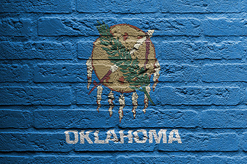 Image showing Brick wall with a painting of a flag, Oklahoma