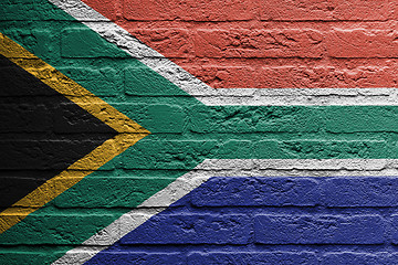 Image showing Brick wall with a painting of a flag