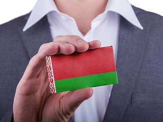 Image showing Businessman showing card, matte paper effect