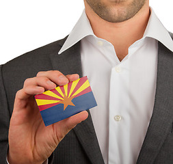 Image showing Businessman is holding a business card, Arizona