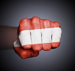 Image showing Front view of punching fist on gray background