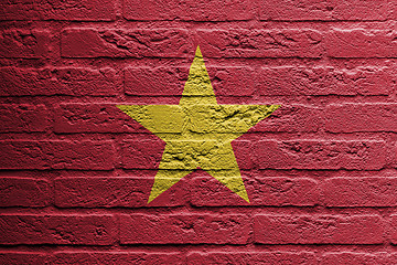 Image showing Brick wall with a painting of a flag