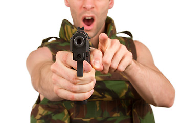 Image showing Soldier in camouflage vest is holding a gun