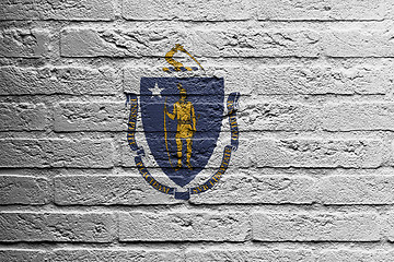 Image showing Brick wall with a painting of a flag, Massachusetts