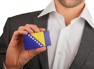 Image showing Businessman is holding a business card, Bosnia and Herzegovina