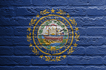 Image showing Brick wall with a painting of a flag, New Hampshire