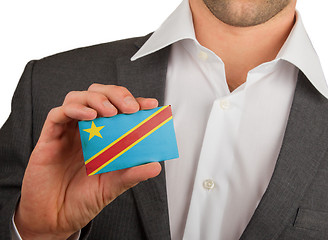 Image showing Businessman is holding a business card, The Democratic Republic 