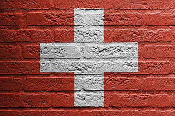 Image showing Brick wall with a painting of a flag, Switzerland