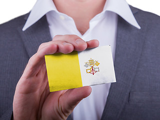 Image showing Businessman showing card, matte paper effect