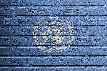 Image showing Brick wall with a painting of a flag, UN