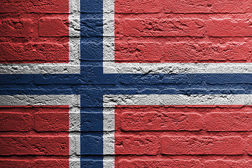 Image showing Brick wall with a painting of a flag