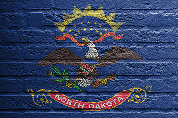 Image showing Brick wall with a painting of a flag, North Dakota