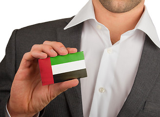 Image showing Businessman is holding a business card, UAE
