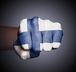 Image showing Front view of punching fist on gray background