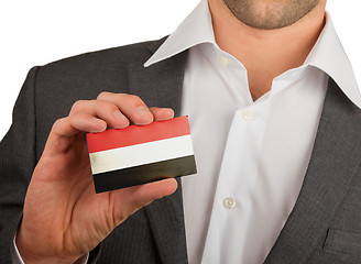 Image showing Businessman is holding a business card, Yemen