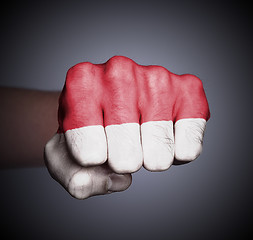 Image showing Front view of punching fist on gray background