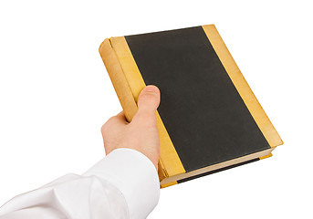 Image showing Businessman holding an old book