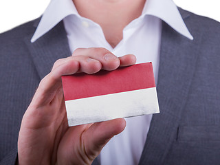 Image showing Businessman showing card, matte paper effect