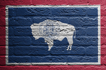 Image showing Brick wall with a painting of a flag, Wyoming