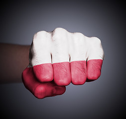 Image showing Front view of punching fist on gray background