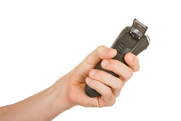 Image showing Hand holding an electric shaver 