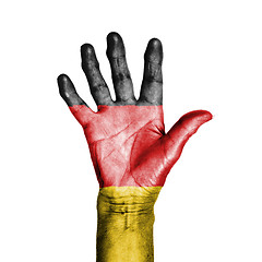 Image showing Hand of an old woman, wrapped with a pattern of the flag of Germ