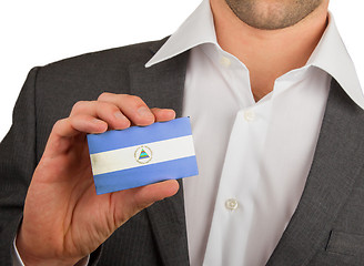 Image showing Businessman is holding a business card, Nicaragua