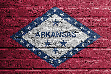 Image showing Brick wall with a painting of a flag, Arkansas