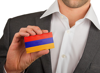 Image showing Businessman is holding a business card, Armenia