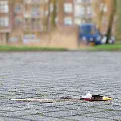 Image showing Burnt-out rocket on the streets