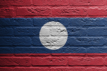 Image showing Brick wall with a painting of a flag, Laos