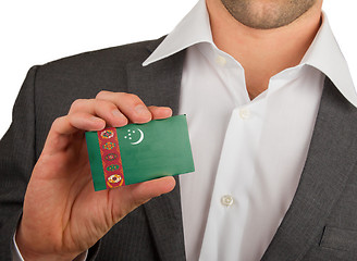 Image showing Businessman is holding a business card, Turkmenistan