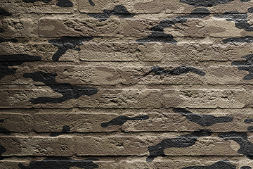 Image showing Brick wall with a painting of a flag, camouflage