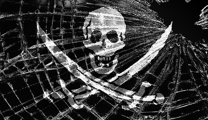 Image showing Pirate flag under broken ice or glass