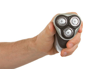 Image showing Hand holding an electric shaver 