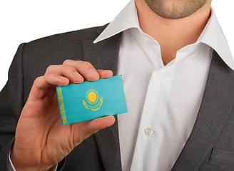 Image showing Businessman is holding a business card, Kazakhstan