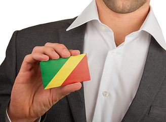 Image showing Businessman is holding a business card, Republic of Congo