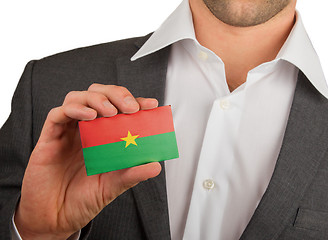 Image showing Businessman is holding a business card, Burkina Faso