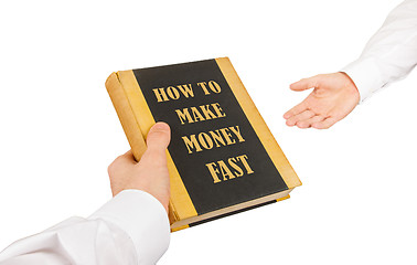 Image showing Businessman giving an used book to another businessman